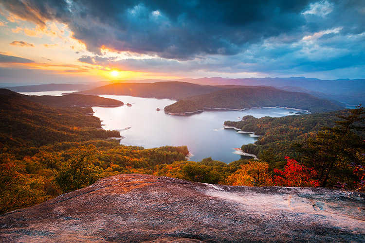 Sunset over Lake Jocassee, forested islands, and autumn mountains from Jumping Off Rock